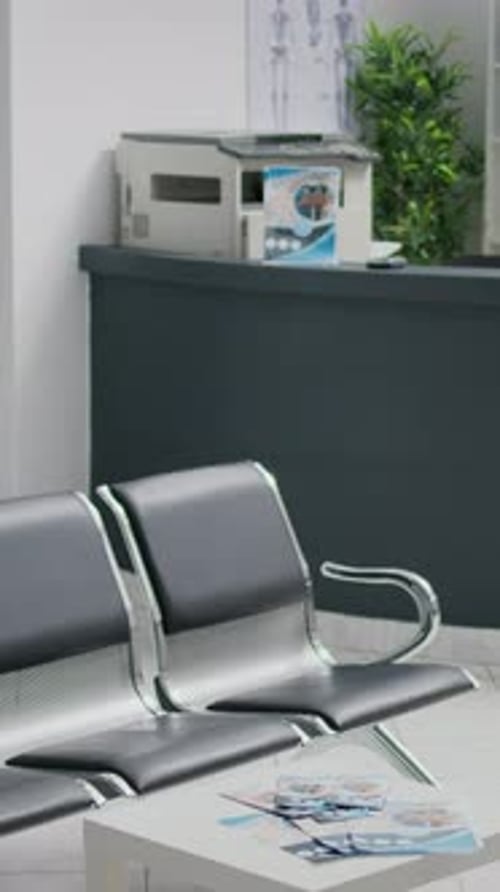 Vertical Video Professional Waiting Room with Chairs in Clinic Hallway