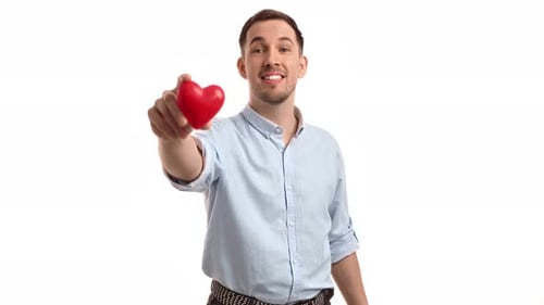 Man Offering a Heart on White Background
