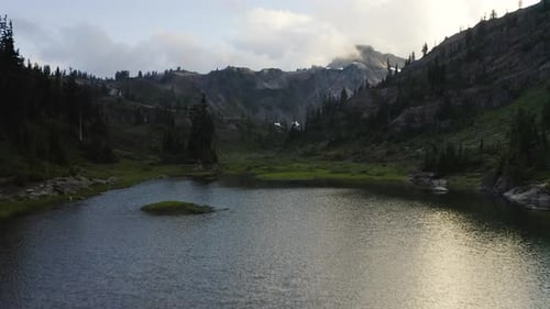 Stunning rugged cloudy forested alpine landscape of Mt Baker in Northern Cascades region of PNW