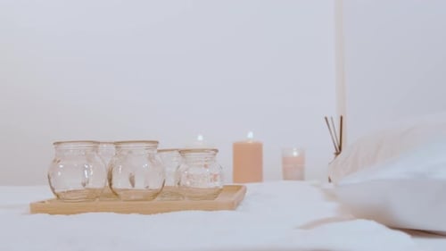 Cupping Jars and Candles on Massage Table