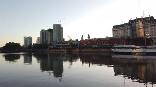 Panoramic of Puerto Madero, Sunset reflection above River, travel landscape of Buenos Aires City