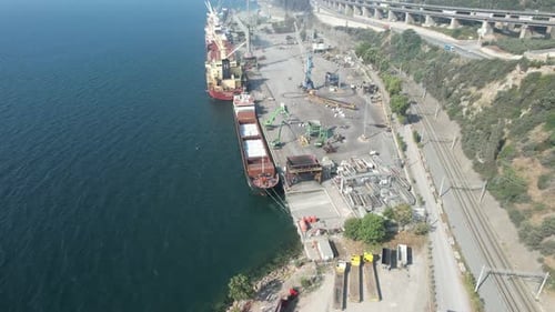 Aerial View of Cargo Ships at Busy Industrial Port