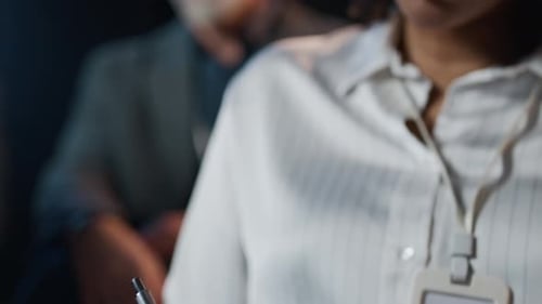 Close Up of Person Taking Notes at Conference