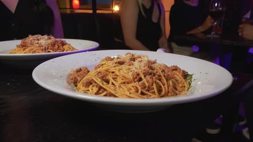 Restaurant spaghetti served on a white plate. Traditional pasta dish of Italian culture.