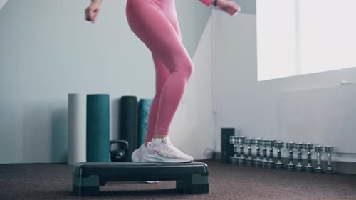 Woman Exercising in Gym