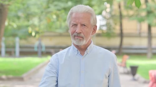 Outdoor Portrait of Senior Old Man in Denial, Rejecting