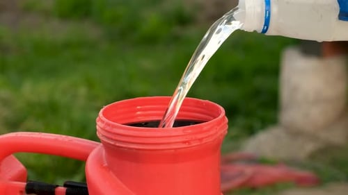 Pour Herbicide Into the Sprayer Selective Focus