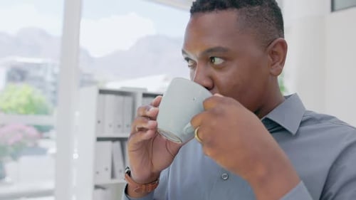 Black man drinking coffee at office desk, computer and pc technology in company