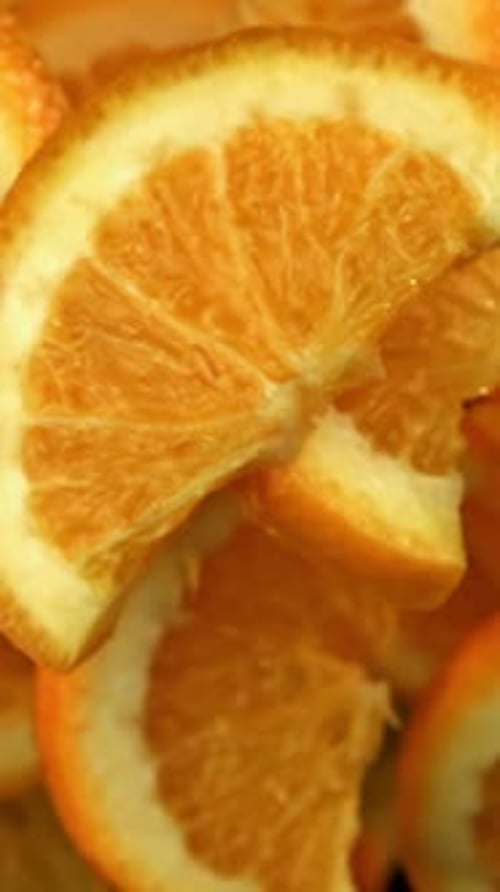 Orange Slices Flying on a Black Background Filmed on a Highspeed Camera at 1000 Fps