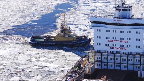 Aerial Winter View of Riga Shipyard Latvia Tug SFINKSA Aids Ship