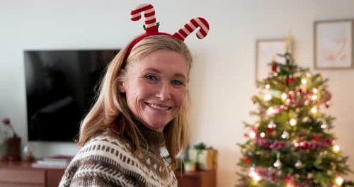 Woman Smiling and Drinking Coffee at Christmas