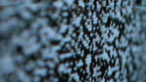 Flickering Close Up Shot of Analog TV Screen