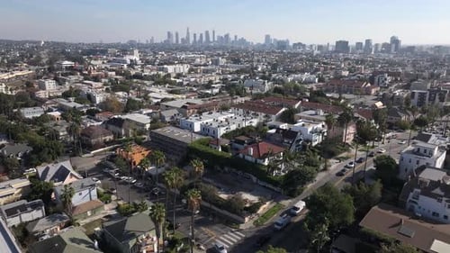 Establishing aerial of Los Angeles neighborhood in East Hollywood with landscape of downtown
