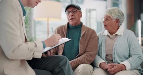 Senior Couple Consults with Young Adult Inside