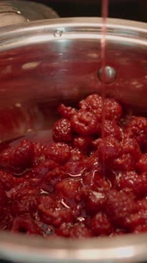 Making Raspberry Jam Inside Metal Pot