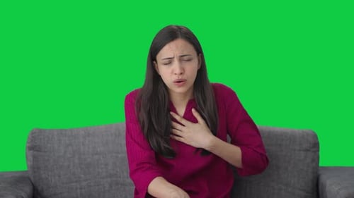 Indian woman having an Asthma attack Green screen