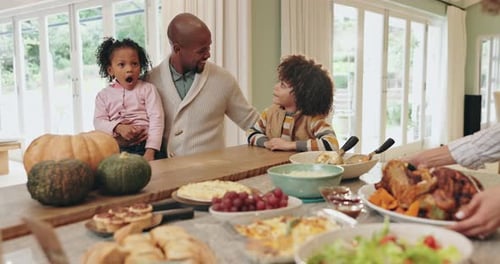 Family Gathered Together Around Food in Bright Home
