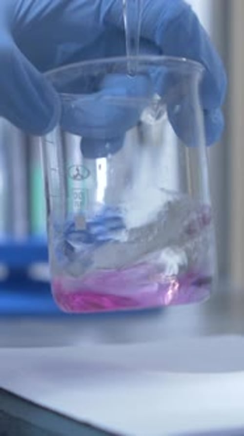 Vertical Closeup Process of Analyzing Quality of Water Liquid in Laboratory