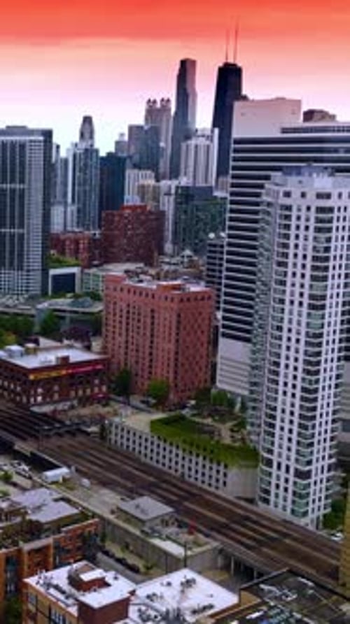 Railways of subway going between the beautiful buildings. Marvelous Chicago city