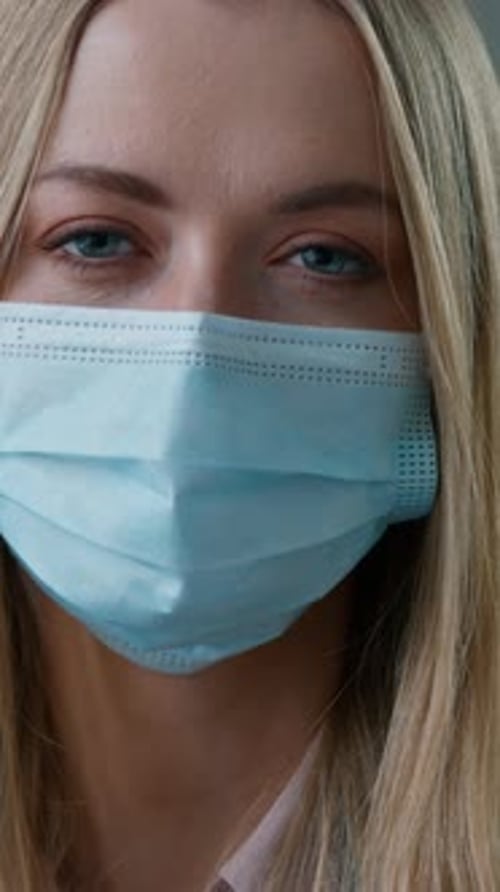 Portrait Caucasian Business Woman in Face Medical Protective Mask in Office with Laptop Working