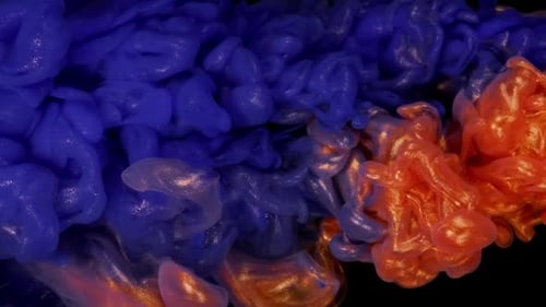 Blue and Gold Ink and Paint Mix Transforming Into Cloud Patterns on Black Background