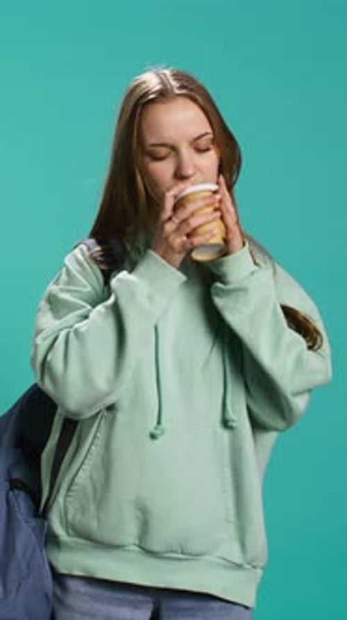 Vertical Video Young Girl Yawning Feeling Tired Drinking Coffee to Wake Up