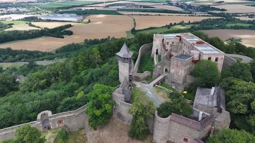 Dynamic Aerial of Helfstyn Castle ruins, historical landmark. Reveal to rural landscape of Czech