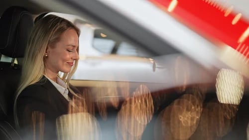 Woman Turns Steering Wheel Inside New Car
