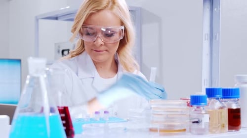 Dedicated Scientist Working in a Bright Research Laboratory
