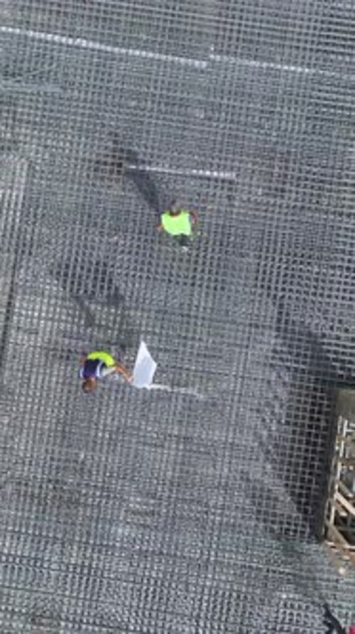 Vertical Video Engineers Coordinate Rebar Bending and Concrete Pouring on a HighQuality Construction