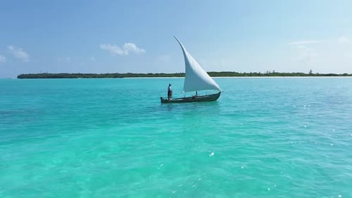 Aerial view of boat sailing on clear water, Maldives.