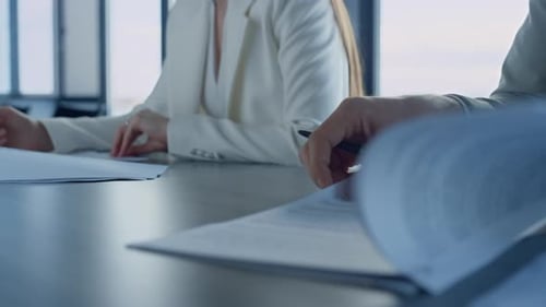 Business team inspecting legal documents in office preparing successful deal