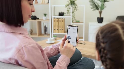Females Surfing Ecommerce Fashion Boutique on Smartphone