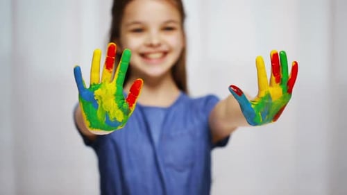 Education, School, Creativity, Art and Painting Concept - Smiling Little Student Girl