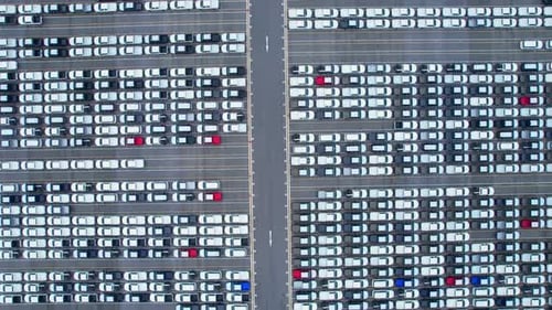 Drones flying over of many vehicles at parking lots