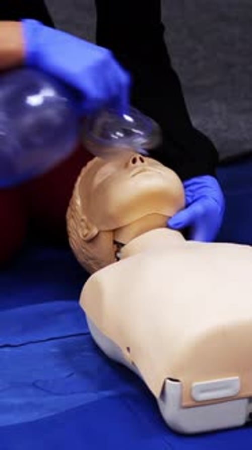 Practicing Bag Valve Mask Technique on Mannequin