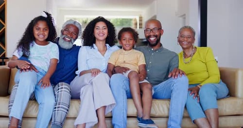 Smiling Family on Couch at Home