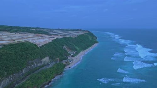 Aerial view of bali coastline with turquoise ocean waves