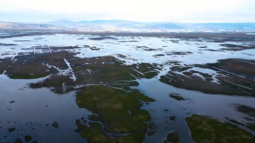 Aerial View of Wetland Landscape with Water Channels and Natural Patterns