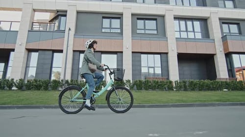Woman Cycling To Work Slowmo