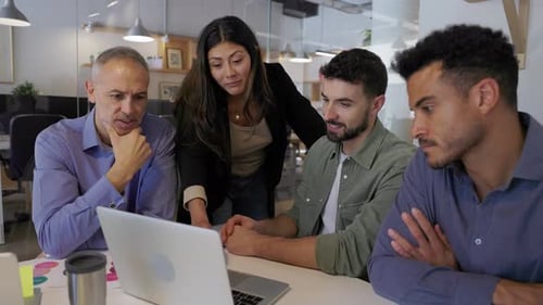 Teamwork in Modern Office: Colleagues Collaborate at Meeting