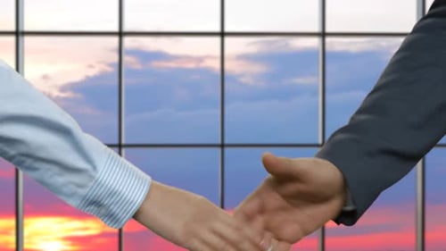 Business Handshake During Beautiful Sunrise
