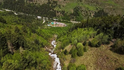 Witness the Majesty of Waterfall and Vibrant Spring Mountain Scenery