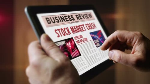Stock market crash and business crisis newspaper on mobile tablet screen