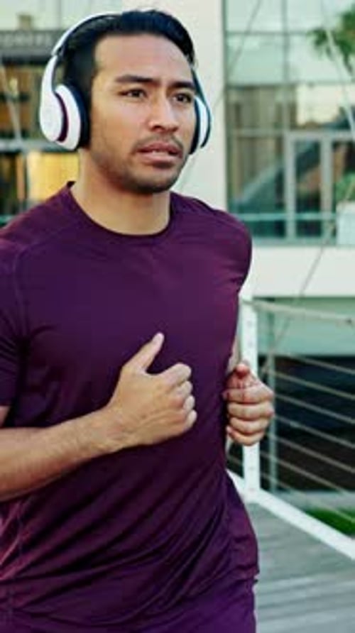 Man, headphones and fitness with running in city on bridge for cardio challenge, sound and wellness
