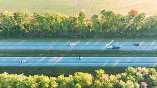 Aerial View of Busy American Highway with Fast Moving Traffic Interstate Transportation Concept