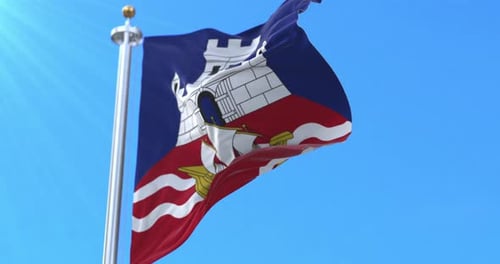 Realistic Waving Flag with Emblem Against Blue Sky