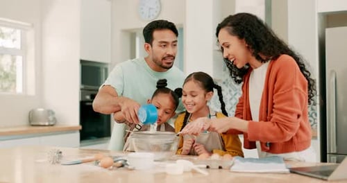 Happy Family Baking Together in Bright Kitchen