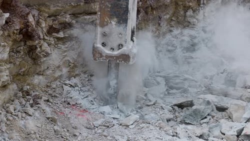 C4k 60 2 74K Slow Motion Jackhammer Breaking Large Rocks.