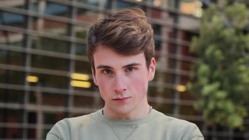 Young Man Portrait Outdoors, Confident Stare, Looking at Camera